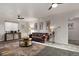 Bright living room with leather sofa, modern lighting, and stylish decor, perfect for relaxation at 295 E Amherst Ave, Englewood, CO 80113