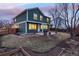 Exterior backyard dusk shot with green home, lawn, and patio at 375 Aspenwood Ct, Lafayette, CO 80026