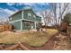 Large green home backyard with patio and fence at 375 Aspenwood Ct, Lafayette, CO 80026