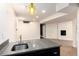 Basement wet bar with granite countertop at 375 Aspenwood Ct, Lafayette, CO 80026
