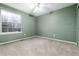 Simple bedroom with neutral carpet and a large window at 375 Aspenwood Ct, Lafayette, CO 80026