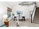 Bright dining area featuring seating for six with views of the living area, and a stairway at 375 Aspenwood Ct, Lafayette, CO 80026