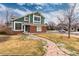 Attractive exterior showcasing brickwork, siding, and a curved walkway leading to the entrance at 375 Aspenwood Ct, Lafayette, CO 80026