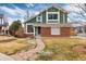 Beautiful home with a combination of brick and siding, complemented by a stone walkway at 375 Aspenwood Ct, Lafayette, CO 80026