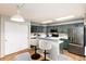 Well-lit kitchen with stainless appliances and a breakfast bar for casual dining at 375 Aspenwood Ct, Lafayette, CO 80026