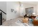 Inviting living area featuring vaulted ceilings, neutral decor, and lots of natural light at 375 Aspenwood Ct, Lafayette, CO 80026