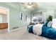 Spacious main bedroom with high ceilings, a ceiling fan, and a large window with natural light at 375 Aspenwood Ct, Lafayette, CO 80026