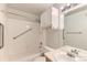 Classic bathroom with a white tiled shower/tub combo and vanity with mirrored medicine cabinet at 1121 W 112Th Ave # C, Denver, CO 80234