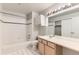 Bathroom featuring tiled floors, a bathtub/shower combo, and a vanity with a sink at 1121 W 112Th Ave # C, Denver, CO 80234