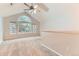 The bedroom has neutral carpeting, a ceiling fan, and several large windows at 1121 W 112Th Ave # C, Denver, CO 80234