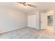 Spacious bedroom featuring neutral carpet and a ceiling fan, offering comfort and style at 1121 W 112Th Ave # C, Denver, CO 80234