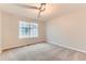 Bright bedroom with a large window and neutral carpet, providing a cozy and inviting atmosphere at 1121 W 112Th Ave # C, Denver, CO 80234