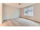 Bedroom featuring neutral carpeting, a ceiling fan, and a window with blinds at 1121 W 112Th Ave # C, Denver, CO 80234