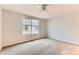 Bedroom featuring neutral carpeting, a ceiling fan, and a window with blinds at 1121 W 112Th Ave # C, Denver, CO 80234