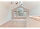 The bedroom has neutral carpeting, a ceiling fan, and several large windows at 1121 W 112Th Ave # C, Denver, CO 80234