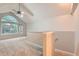 The bedroom has neutral carpeting, a ceiling fan, and several large windows at 1121 W 112Th Ave # C, Denver, CO 80234