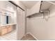 Walk-in closet with sliding door, shelving, and hanging rod for optimal organization at 1121 W 112Th Ave # C, Denver, CO 80234