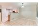 Bright dining area featuring tile floors, neutral walls and natural light from a window at 1121 W 112Th Ave # C, Denver, CO 80234
