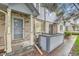 Attractive townhome with gray door, featuring a brick facade and well-kept front entry at 1121 W 112Th Ave # C, Denver, CO 80234