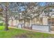 Charming brick townhome featuring a well-maintained front yard and a welcoming entrance at 1121 W 112Th Ave # C, Denver, CO 80234