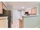 Efficient kitchen design featuring stainless steel appliances with a view of the entry at 1121 W 112Th Ave # C, Denver, CO 80234