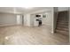 Finished basement with kitchenette and wood-look flooring at 2260 S Lewiston St, Aurora, CO 80013