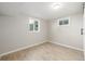 Cozy bedroom featuring two windows and light-colored walls at 2260 S Lewiston St, Aurora, CO 80013