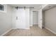 Bright bedroom with white barn door and neutral color palette at 2260 S Lewiston St, Aurora, CO 80013