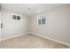 Bedroom with two windows, and wood-look floors at 2260 S Lewiston St, Aurora, CO 80013