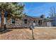 Charming stone house featuring a manicured lawn and a mailbox at 2260 S Lewiston St, Aurora, CO 80013