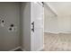 Laundry room with washer/dryer hookups and modern barn door at 2260 S Lewiston St, Aurora, CO 80013