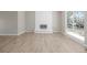 Bright living room featuring a fireplace and large windows for ample light at 2260 S Lewiston St, Aurora, CO 80013