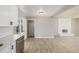 Open-concept living area featuring light walls and fireplace at 2260 S Lewiston St, Aurora, CO 80013
