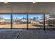 Covered back patio with concrete floor offering views of the expansive, unfenced backyard at 2260 S Lewiston St, Aurora, CO 80013