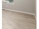 Clean, empty room with new flooring and fresh paint at 2260 S Lewiston St, Aurora, CO 80013