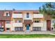 Two-story apartment building featuring multiple balconies and a well-maintained lawn at 10211 Ura Ln # 2-207, Thornton, CO 80260