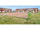 View of community sandbox and apartment complex at 10211 Ura Ln # 2-207, Thornton, CO 80260