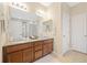 Bathroom featuring double sinks, a shower, and tile floors at 25811 E Archer Ave, Aurora, CO 80018