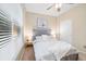 Comfortable bedroom with a queen-sized bed, carpet flooring, and natural light from the window at 25811 E Archer Ave, Aurora, CO 80018