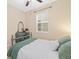 Bright bedroom with a vintage dresser and comfortable bed at 25811 E Archer Ave, Aurora, CO 80018