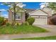 Charming single-Gathering home featuring a brick facade, two-car garage, and a well-manicured front lawn at 25811 E Archer Ave, Aurora, CO 80018