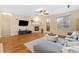 Comfortable living room with fireplace, ceiling fan, and access to the outdoors at 25811 E Archer Ave, Aurora, CO 80018