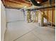 Unfinished basement space with exposed ceiling and concrete floor at 25952 E 5Th Pl, Aurora, CO 80018