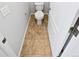 A small toilet room has tile floors and a white toilet at 25952 E 5Th Pl, Aurora, CO 80018