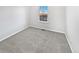 Neutral bedroom with light gray carpet and a view from the window at 25952 E 5Th Pl, Aurora, CO 80018