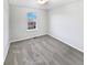 Neutral bedroom with light gray carpet and a view from the window at 25952 E 5Th Pl, Aurora, CO 80018