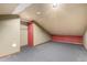 Unfinished attic featuring carpeting and overhead lighting at 1060 S Eaton St, Lakewood, CO 80226