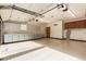 Spacious garage with plenty of storage cabinets and a large countertop work area at 1060 S Eaton St, Lakewood, CO 80226