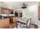 Well-appointed kitchen with wood cabinets, granite counters, and modern appliances at 1060 S Eaton St, Lakewood, CO 80226