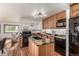 Updated kitchen with granite countertops and stainless steel appliances at 1060 S Eaton St, Lakewood, CO 80226